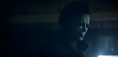 a man standing in the dark with his head turned to the side, staring at something Halloween 2018 Michael Myers 2025, Michael Myers 2018, Michael Myers Banner, black