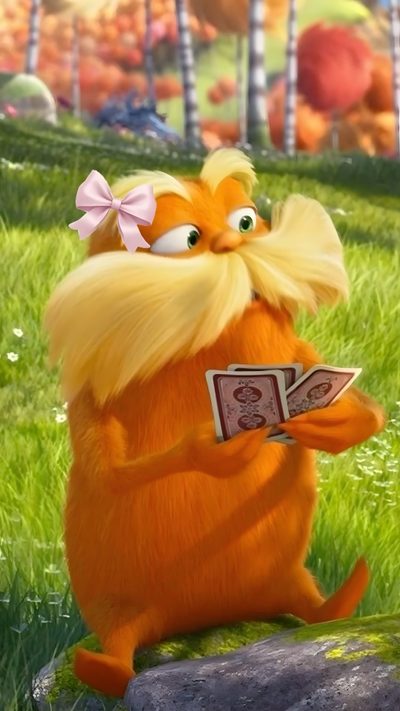 the lorax is reading a book while sitting on a rock in the grass Preppy Lorax Halloween Lorax Reaction Pic, The Lorax Pfp, Lorax Aesthetic, The Lorax Aesthetic, sienna