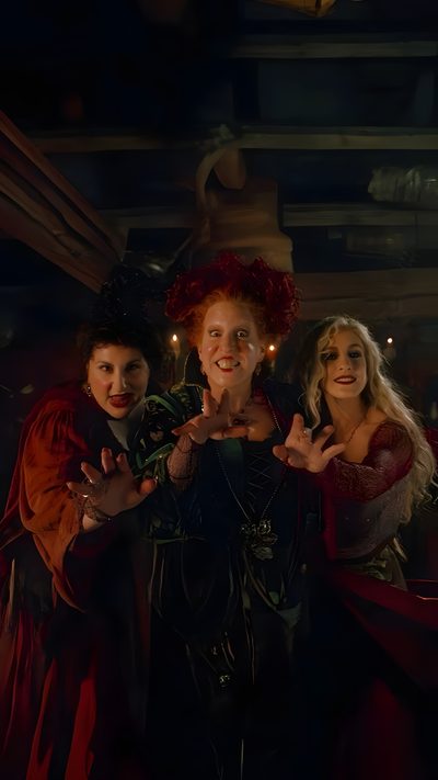 three women dressed in costumes posing for the camera with their hands up and lights on Halloween Hocus Pocus Iconic Halloween Movie Scenes, Halloween Movie Characters, Halloween Movie Backgrounds, black