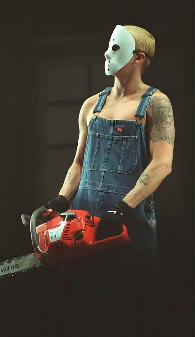 a man in overalls and a mask holding a power tool with one hand on his hip Eminem Halloween Slim Shady Jason Mask, Eminem Overalls, Eminem Jason Mask Drawing, dark slate gray