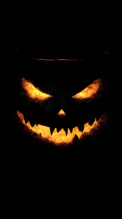 a scary pumpkin with glowing eyes in the dark Halloween Black Backgrounds Halloween Scary, Scary Halloween Backgrounds, Halloween Realistic,