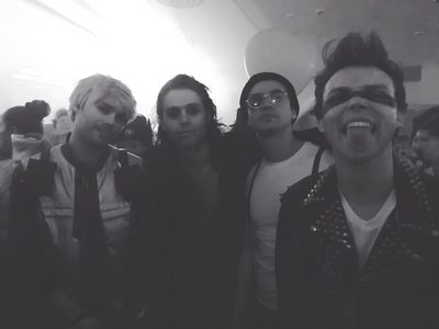 a group of young men standing next to each other 5sos Halloween 5sos Halloween, 5sos Halloween Costumes, Michael Clifford Halloween, dark slate gray