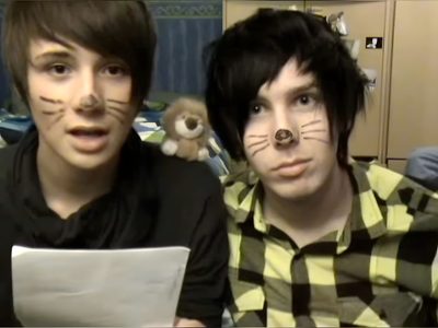 two young men with fake cats on their faces Dan And Phil Halloween 2009 2009 Dan And Phil, Dan And Phil, dark olive green