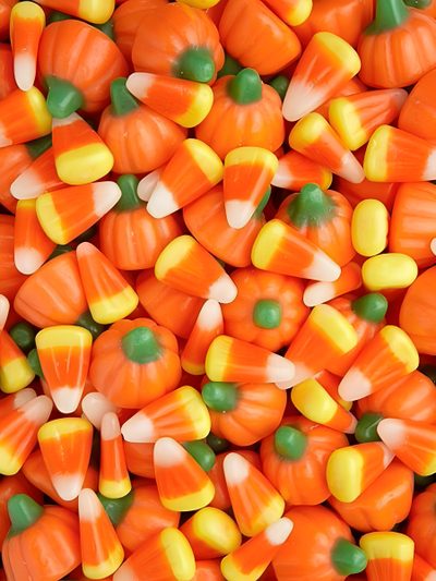 a pile of orange and yellow candy corn Halloween Candy Corn Halloween Candy Corn Taffy, Colorful Halloween Candy Corn, Autumn Mix Candy Corn, chocolate