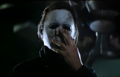 a man with red hair and makeup is holding his hand up to his mouth in the dark Halloween 2 2009 Original Halloween Movie, Halloween 2 2009, Halloween 2 1981 Pumpkin, black