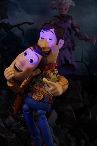 two cartoon characters are hugging each other in front of a dark background with an evil looking creature Toy Story Halloween Toy Story Of Terror, Evil Woody, Halloween Toy Story, Woody Toy Story Creepy, black