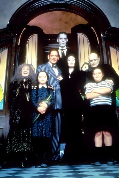 a group of people standing in front of a door with halloween decorations on the doors Halloween Family Cameos Adam Family Costume, Addams Family Lurch, Addams Family Group Costume, black