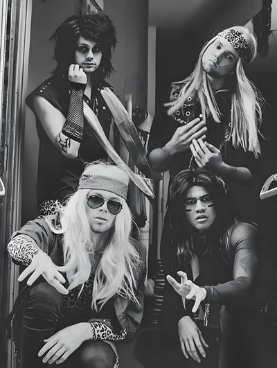 the runaways posing for a black and white photo in front of an open door 5sos Halloween Rock Of Ages, Daniel Webber Motley Crue, Cast Of Rock Of Ages 2012, dark slate gray