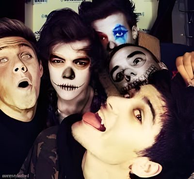 a group of people with their faces painted to look like they're from the addams One Direction Halloween One Direction Twilight, One Direction Batman, One Direction Lipstick, dark slate gray