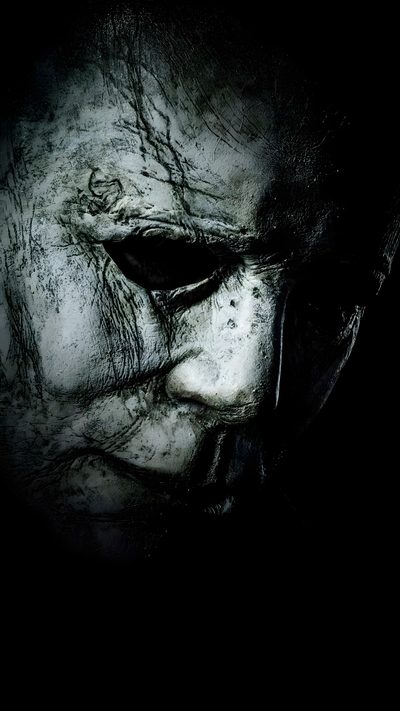 an evil looking man with his face painted white and black, in the darkroom Michel Myers Halloween Iphone Free Halloween Movies, Film, Halloween, Digital, Best Halloween Movies, black