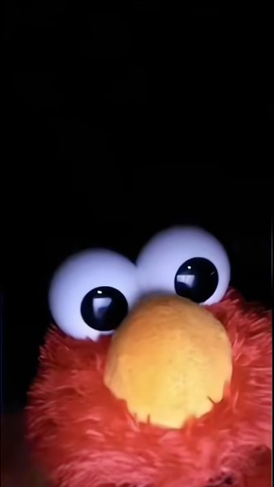 an orange stuffed animal with big eyes on it's face and one eye open Elmo Halloween Elmo Aesthetic Dark, Elmo Black, Elmo X Eyes, Funny Elmo Iphone, Funny Elmo, Iphone Elmo,