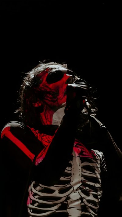 a man in skeleton costume holding his hand up to his face and looking into the distance Mcr Halloween Mcr Skeleton, My Chemical Romance Red Background, Mcr 4k, Mcr Background, Black Parade,