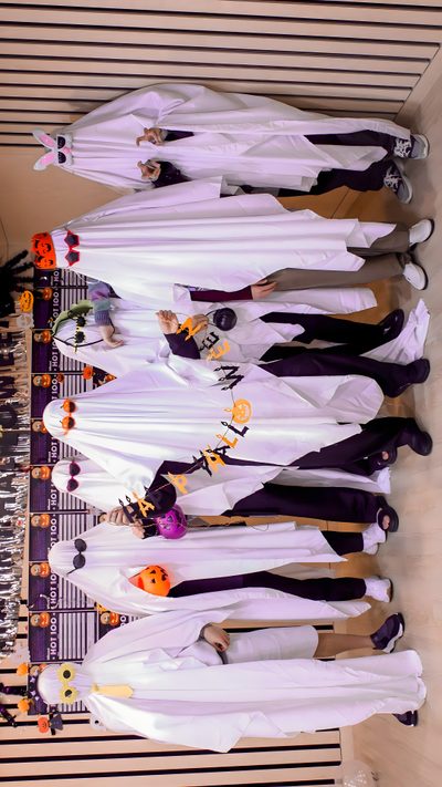 a group of people standing next to each other in front of a wooden table with halloween decorations on it Bts Halloween Bts Theme, Bts Thanksgiving, Bts Pumpkin Painting, Bts Fall, Bt21 Halloween, rosy brown