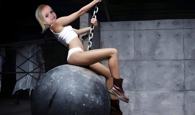a woman sitting on top of a rock with chains around her ankles and wearing cowboy boots Wrecking Ball Halloween Wrecking Ball Aesthetic, Wrecking Ball Skin, Wrecking Ball Background, dark slate gray