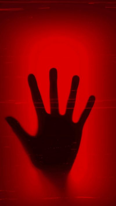 a hand is silhouetted against a red background with the shadow of a person's hand Halloween Red Halloween Red Background, Wallcraft Live, Dark Mao, Suspense Story, Iphone Live Gif, maroon