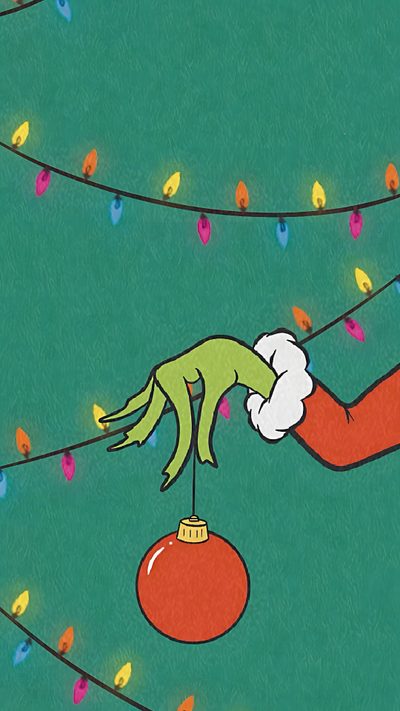 an elf is hanging upside down on a christmas ornament with lights around him Halloween Grinch Christmas Backgrounds For Phones, X Mas Aesthetic Grinch, Christmas Screen, sea green