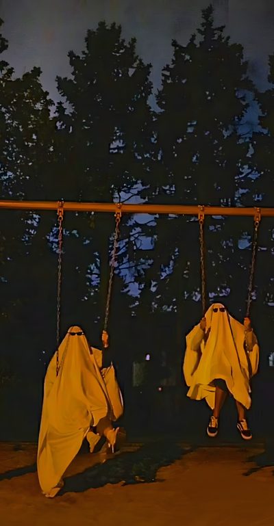 two people in white cloths are on swings at night with trees in the background Best Friend Halloween Two Ghost Aesthetic, Ghost Hunting, Halloween Aesthetic Ghost, black