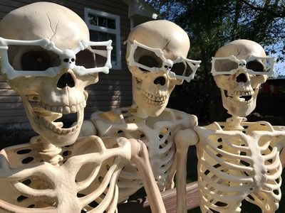 three skeleton statues sitting on a bench in front of a house with their eyes closed Trio Halloween 3 Skeletons, Skeleton Friends, Three Skeletons, Trio Skeleton, 6 Skeleton Friends, dim gray