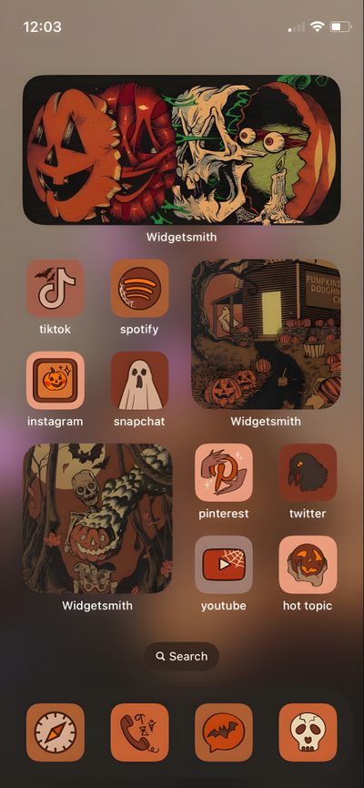 an iphone screen with halloween stickers and icons on the bottom right corner, including pumpkins Halloween Ideas Ios 16 Halloween Themed Homescreen, Phone Themes Halloween, Halloween Iphone Theme Ideas, saddle brown