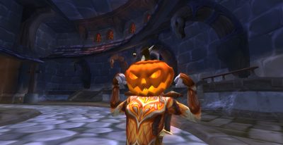 an animated character dressed as a pumpkin in a dark room with stone floors and walls World Of Warcraft Halloween Halloween Video Game, World Of Warcraft, Pumpkin Carving, dark slate gray
