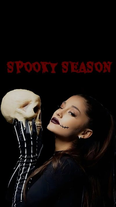 a woman holding a skull in her hand with the words spooky season on it Ariana Grande Halloween Ariana Grande Corpse Bride, Ariana Grande Jack Skellington, Ariana Grande Halloween 2023, black