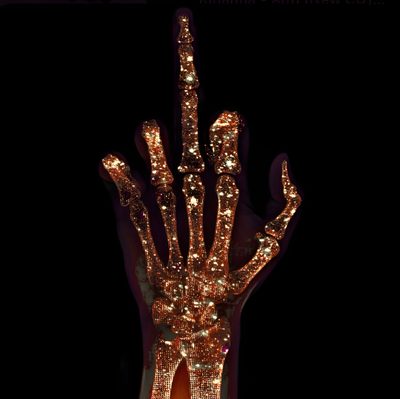 a lighted hand is in the dark with its fingers spread out and lights are shining on it Halloween Middle Finger Gold Grunge Aesthetic, Glitter Skeleton, Gold Skeleton Aesthetic, black