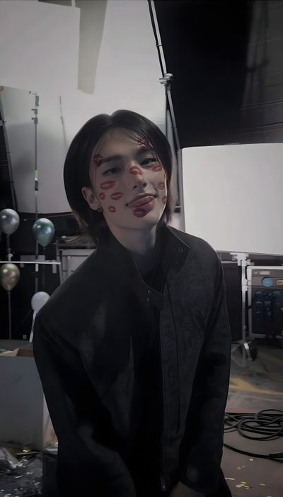 a young man with his face painted red and black, standing in front of a drum set Hyunjin Halloween Hyunjin Joker, Hyunjin Walpaper, Hyunjin And Lee Know, Hyunjin And In, dark slate gray