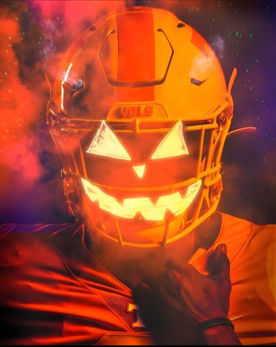 a football player wearing an orange and yellow helmet with glowing pumpkins on it's face Halloween Football Justin Jefferson Halloween, Vols Football Logo, Background Fire Nfl Sick Football, brown
