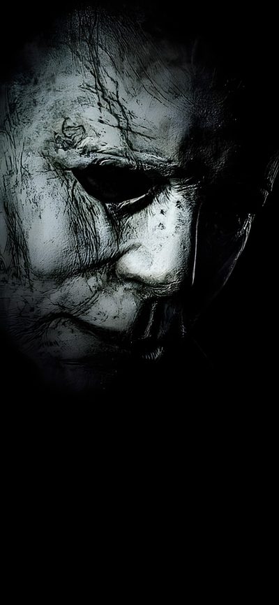 an evil looking man in the dark with his eyes open Halloween Resurrection Michael Myers’s, Halloween Iphone Michael Myers, Android Michael Myers, black