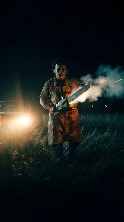 a man in an orange raincoat holding a fire extinguisher next to a car Horror Halloween Iphone With A Person Leather Face, Horror Photography, Scary Tattoos, black