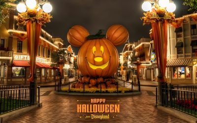 a mickey mouse pumpkin is on display in the middle of a street with lights around it Magic Kingdom Halloween Halloween, Disney Photos, Disneyland California, Disneyland Resort, saddle brown